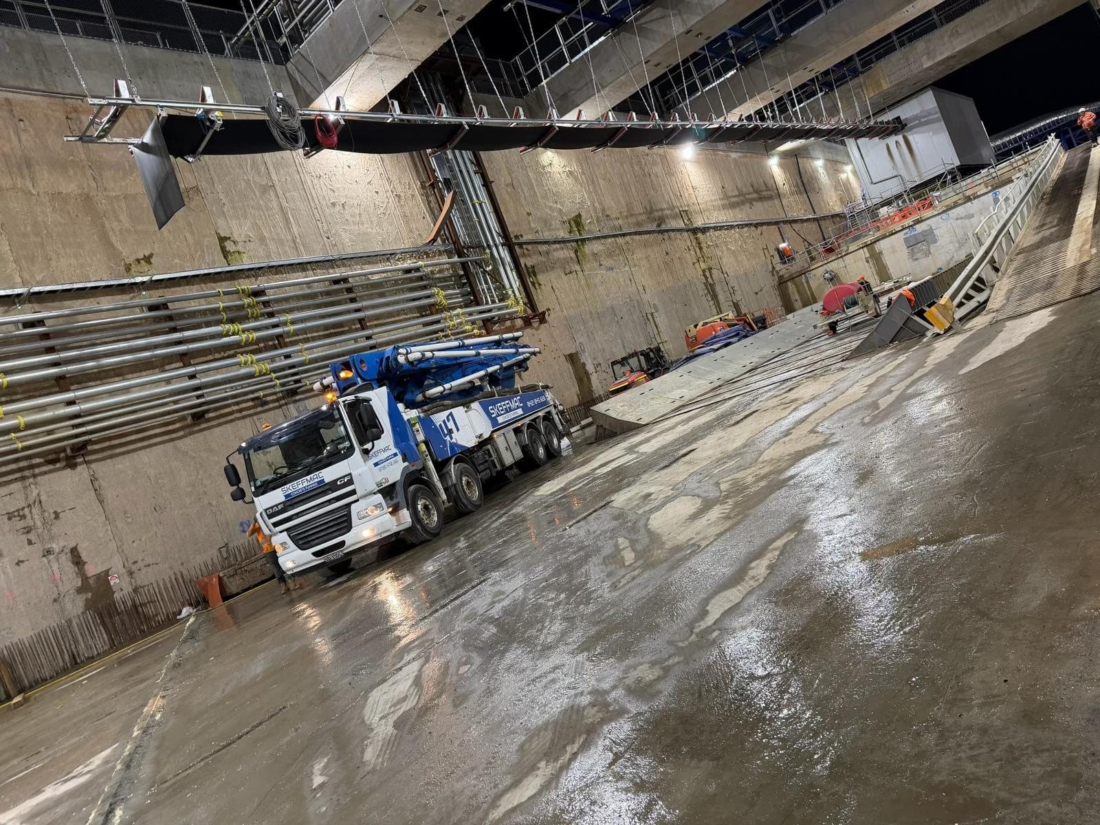 47m boom pump set up underground on a night shift