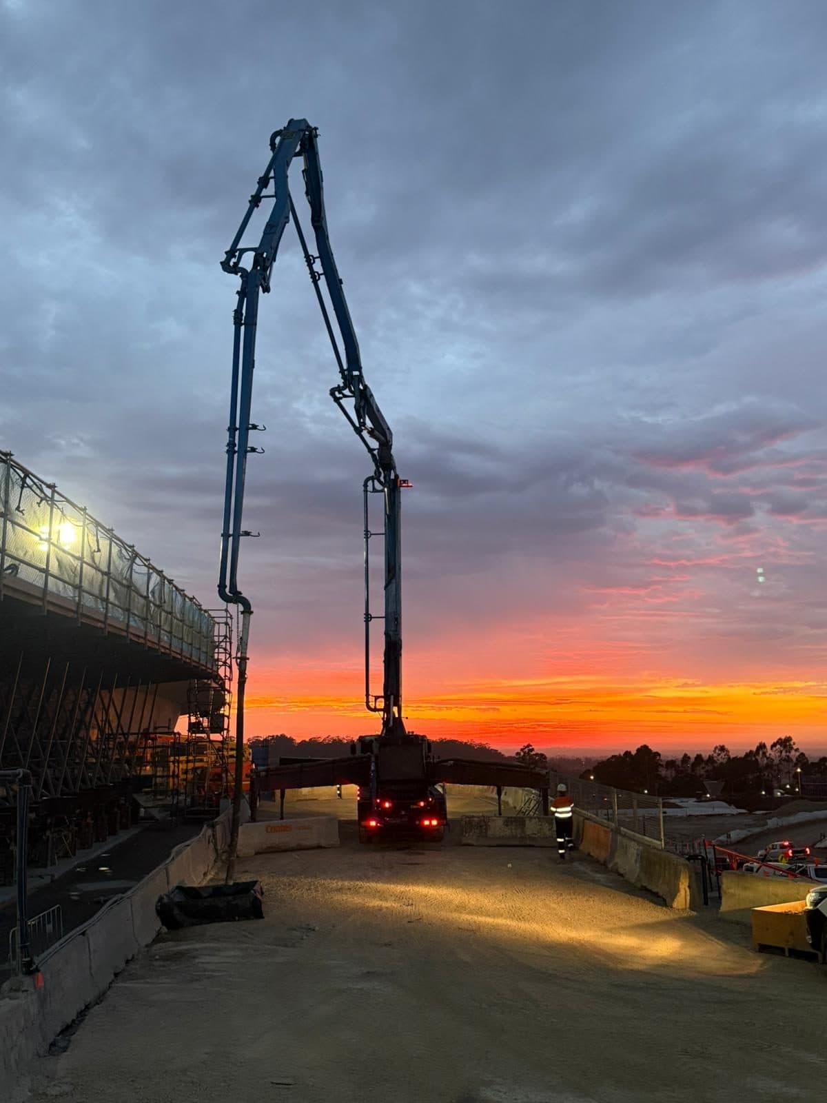 Boom on site under a red sky