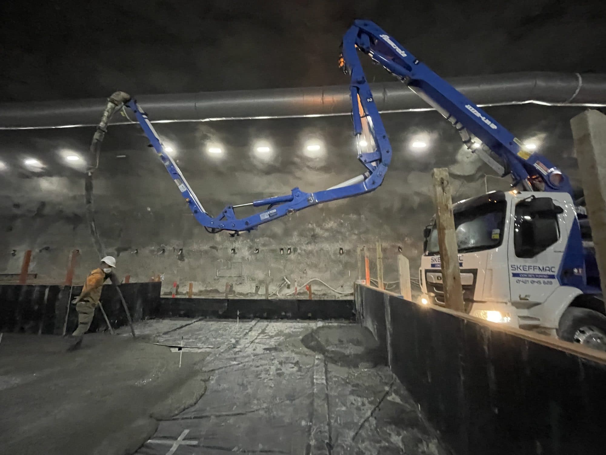 Boom placing concrete underground in a Sydney tunnel